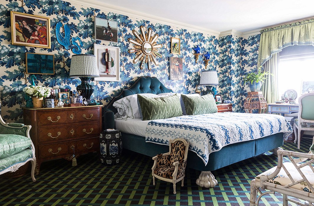 An upholstered bed with sculptural feet forms a grand focal point. “A bedroom can be beautifully decorated,” Alex says, “but if the bed isn’t paid attention to, the whole room falls flat.”
